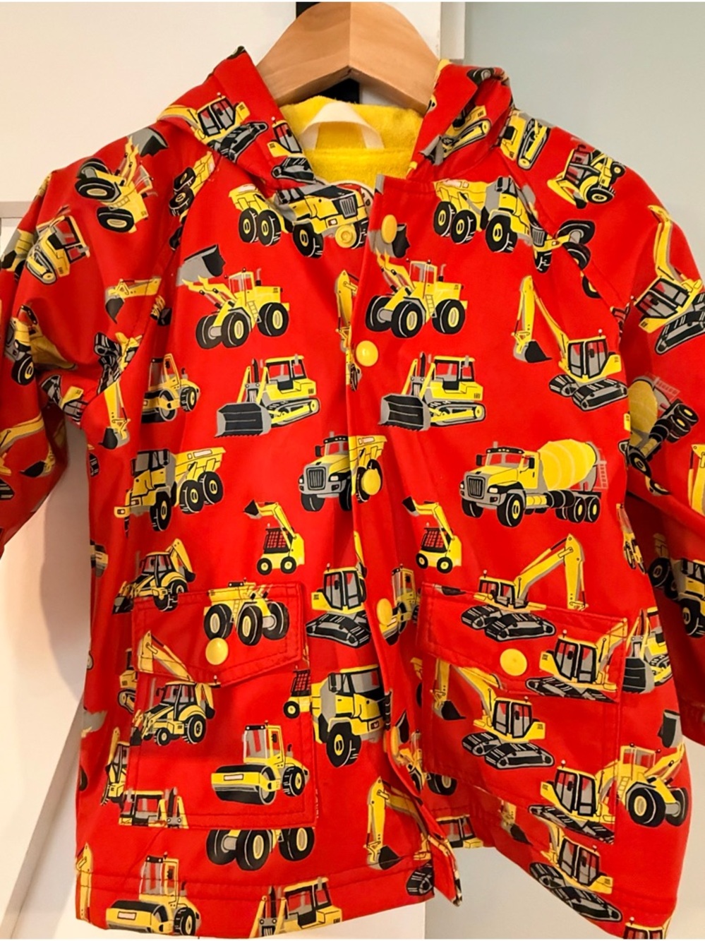Hatley Kid’s Raincoat with Construction Trucks. Lightly lined.